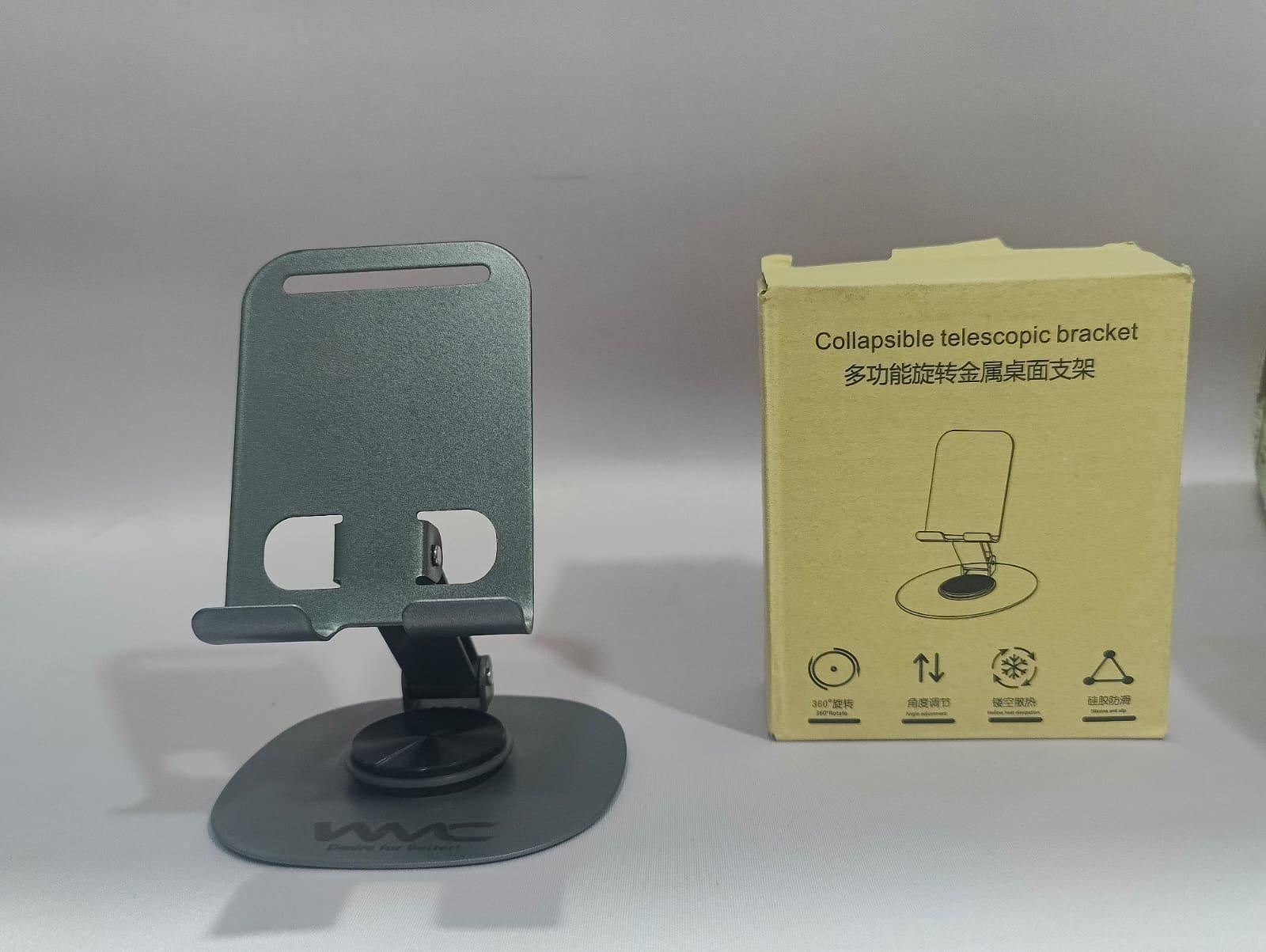 2025/05/1000078320.jpg WMC Metal Mobile Phone Stand – Adjustable & Foldable Table Stand for All Smartphones in Pakistan - Image 1